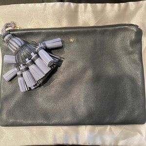 Anya Hindmarch leather clutch with tassel